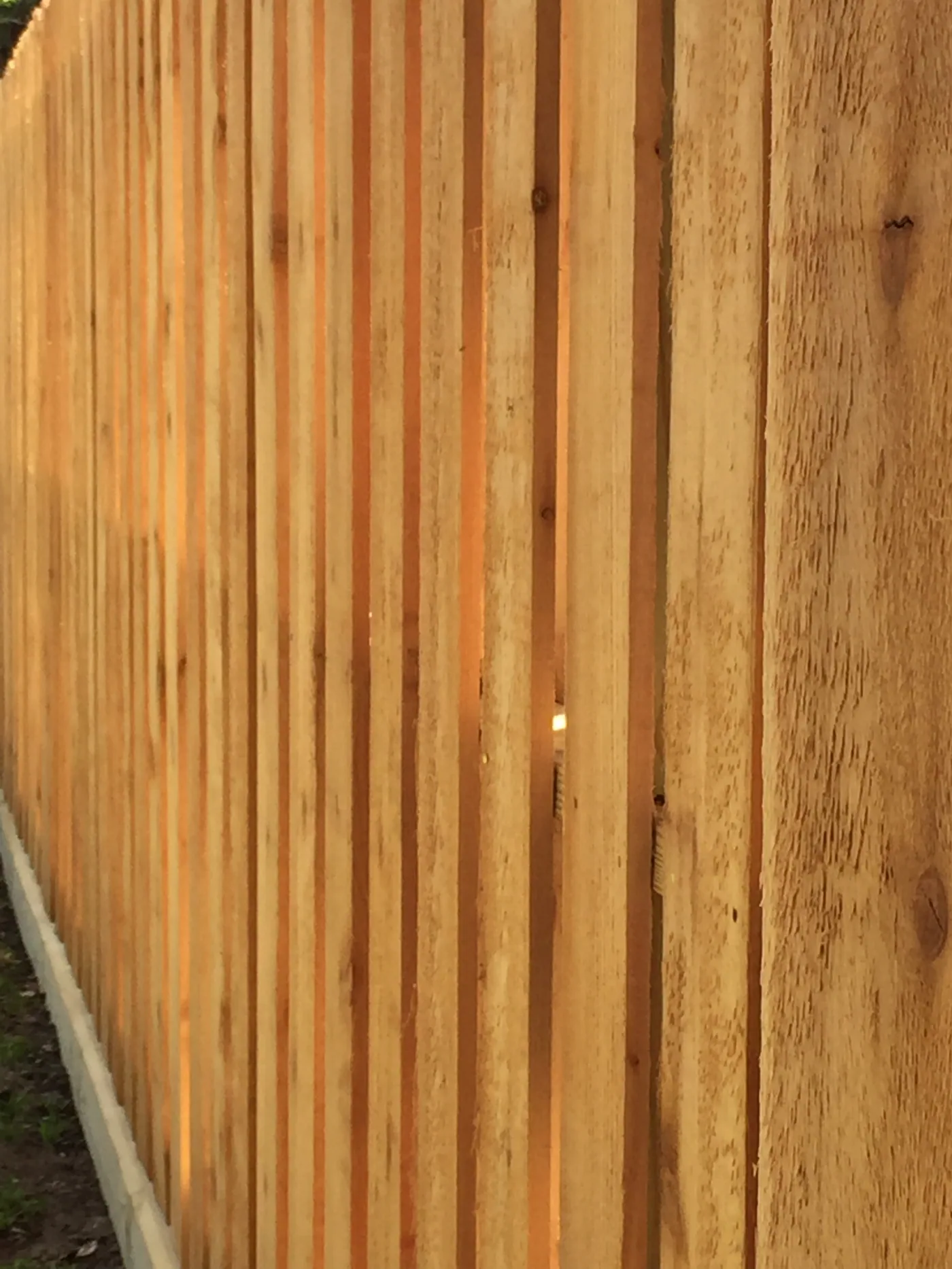 Close view of wood fence pickets, the scale of section a repair replaces