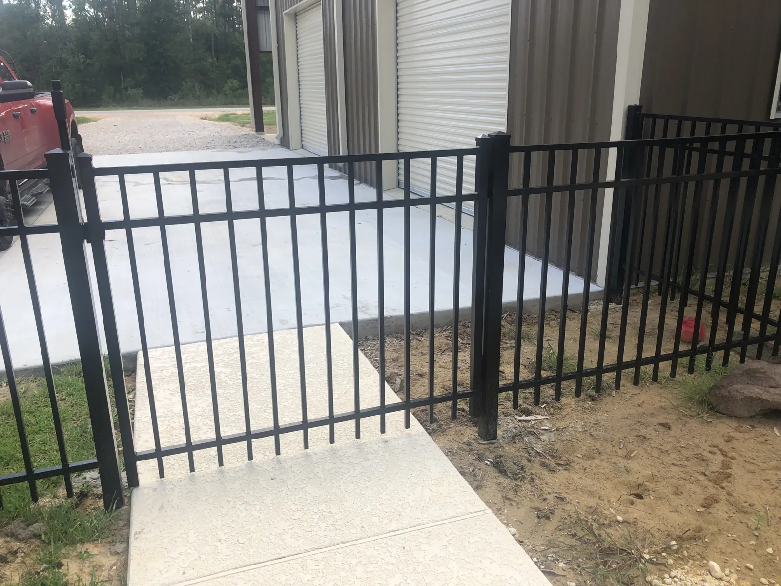 Ornamental iron security fencing along a walkway at a commercial building